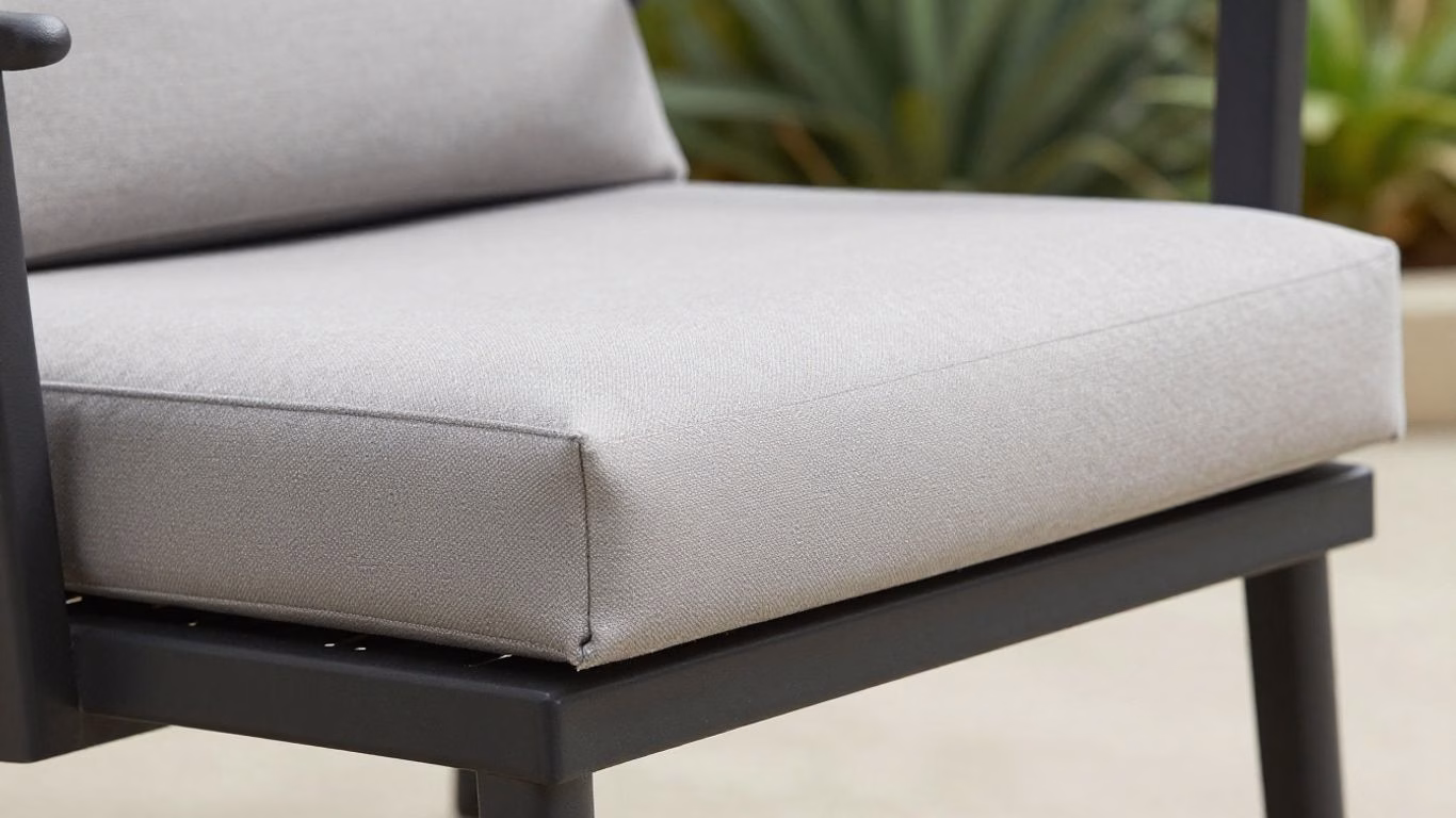 Patio cushion sliding off an outdoor chair.